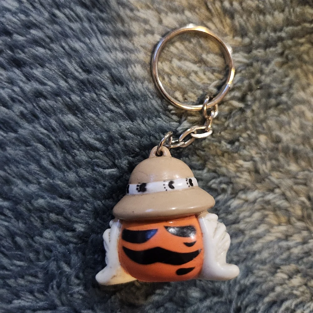 vintage 1997 Exxon Tiger promotional keychain, featuring the company's tiger